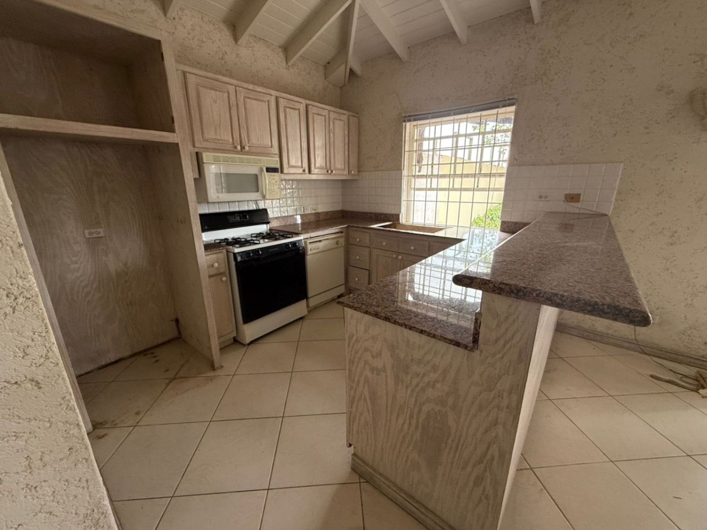 COMPLETE SOLID WOODEN U SHAPE KITCHEN CABINETRY W/ GRANITE COUNTERTOP + BAR (OVERALL MEASUREMENTS: 105” x 120” x 95”)   - BUYER TO REMOVE