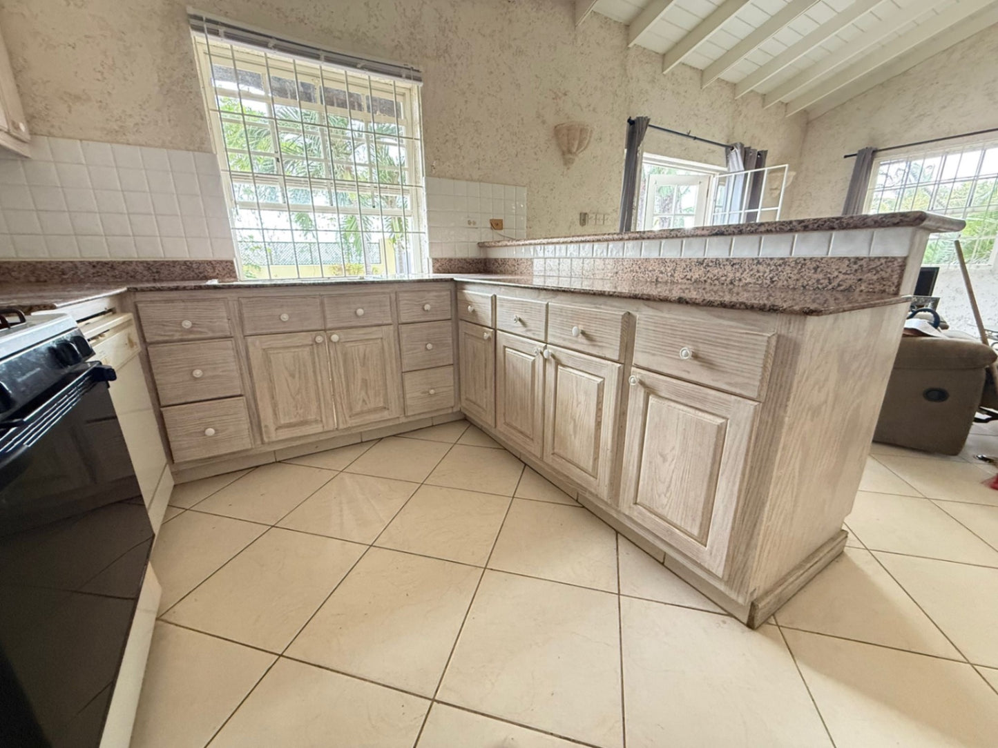 COMPLETE SOLID WOODEN U SHAPE KITCHEN CABINETRY W/ GRANITE COUNTERTOP + BAR (OVERALL MEASUREMENTS: 105” x 120” x 95”)   - BUYER TO REMOVE